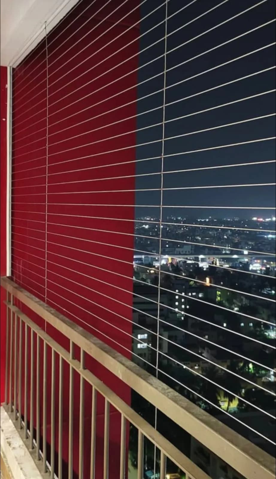 Balcony safety net in daylight with an open outdoor view
